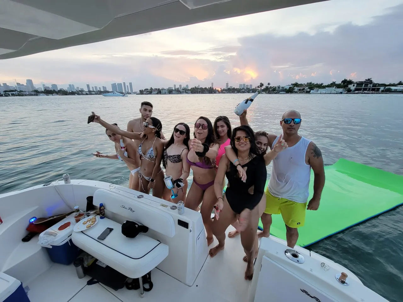 Couple celebrating a birthday on a yacht with champagne