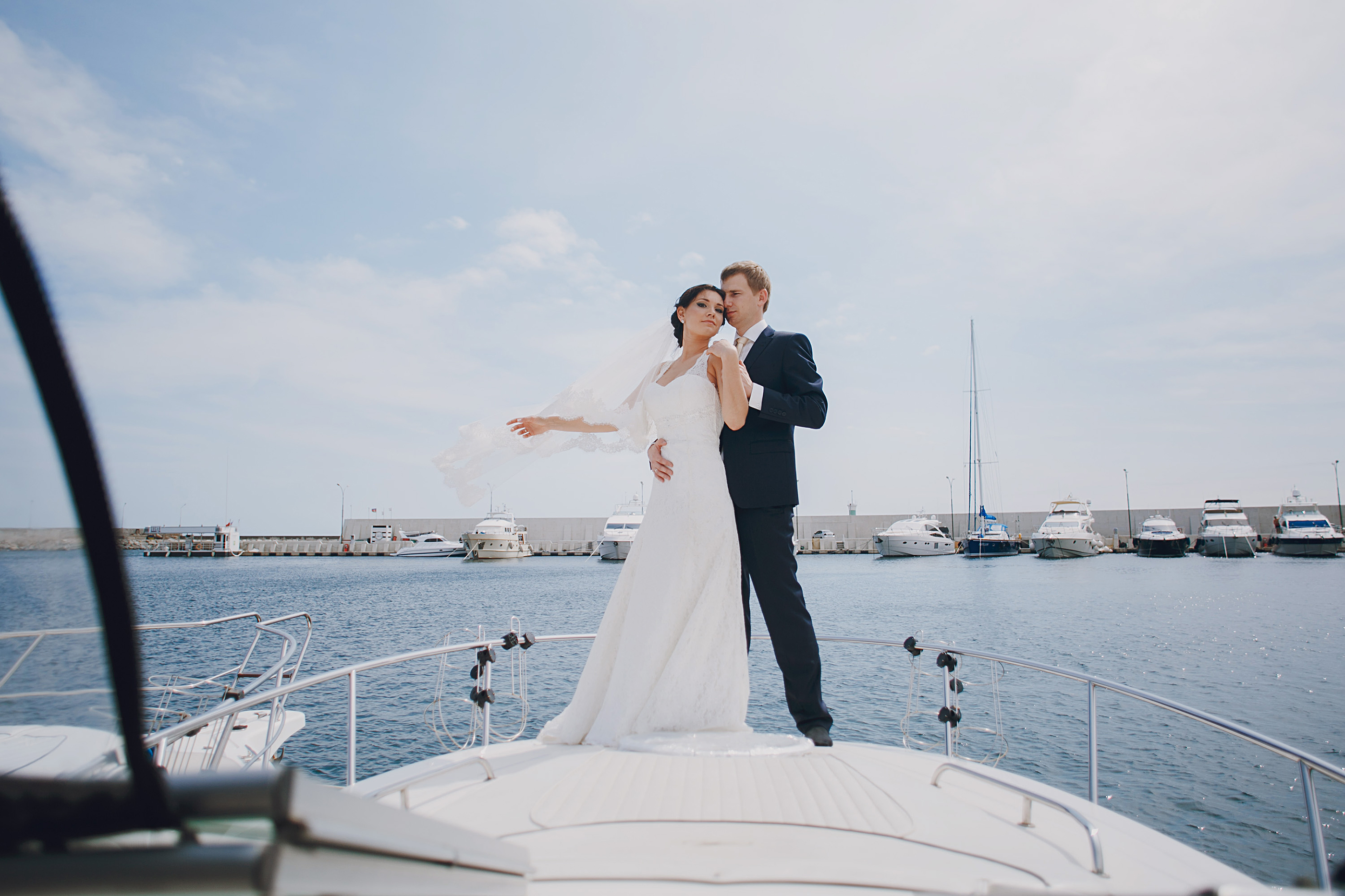 Couple at an intimate sunset dinner aboard a yacht