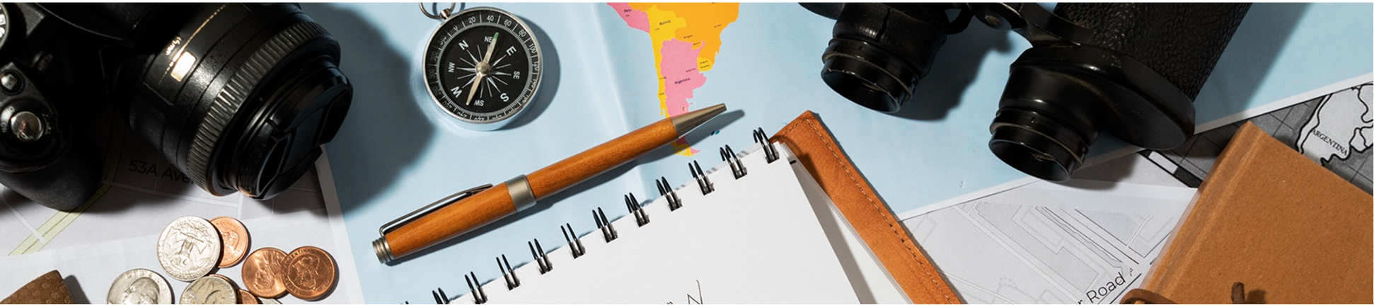 Map and travel planning items on a desk