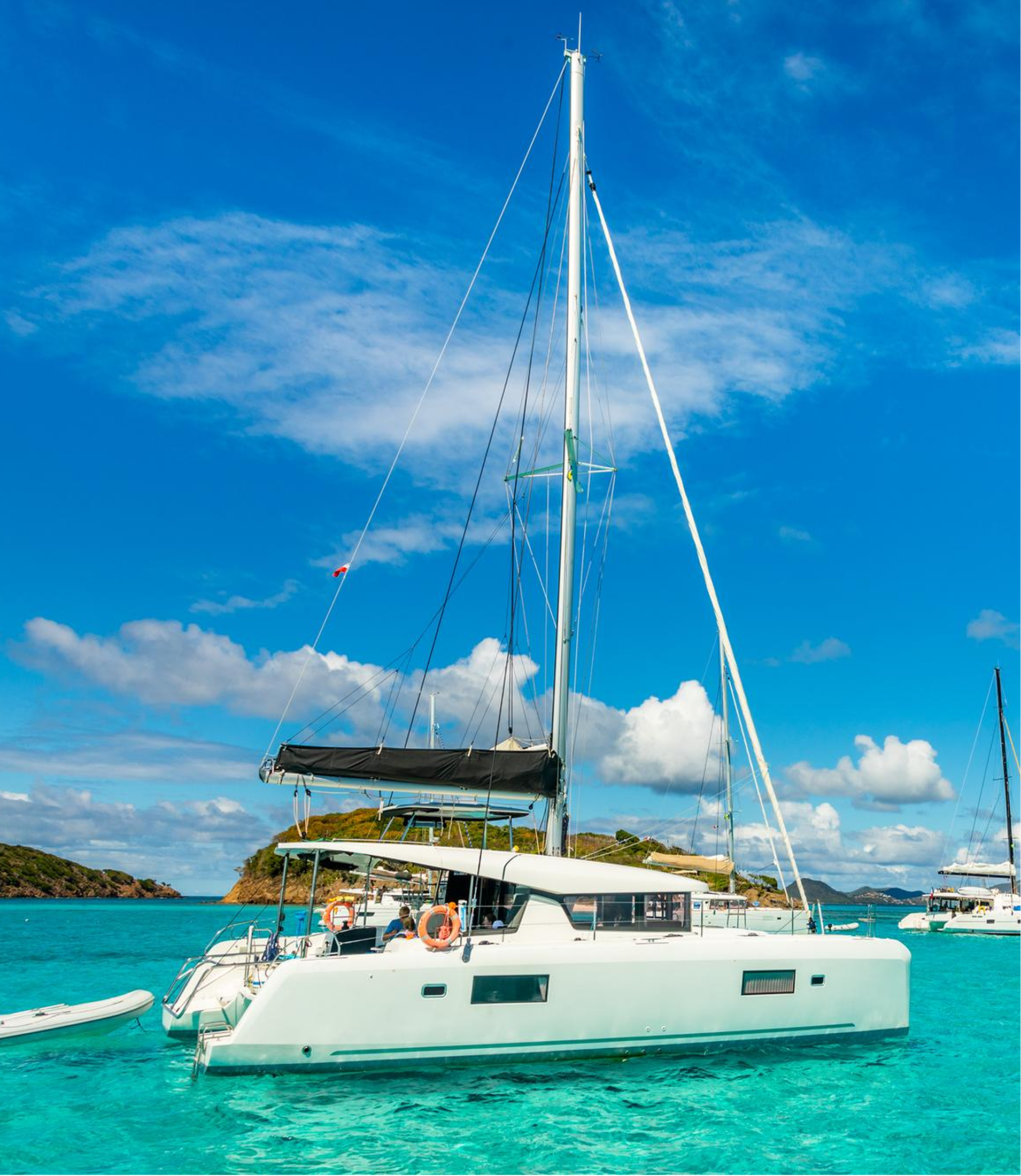 Catamaran anchored in turquoise Bahamas waters