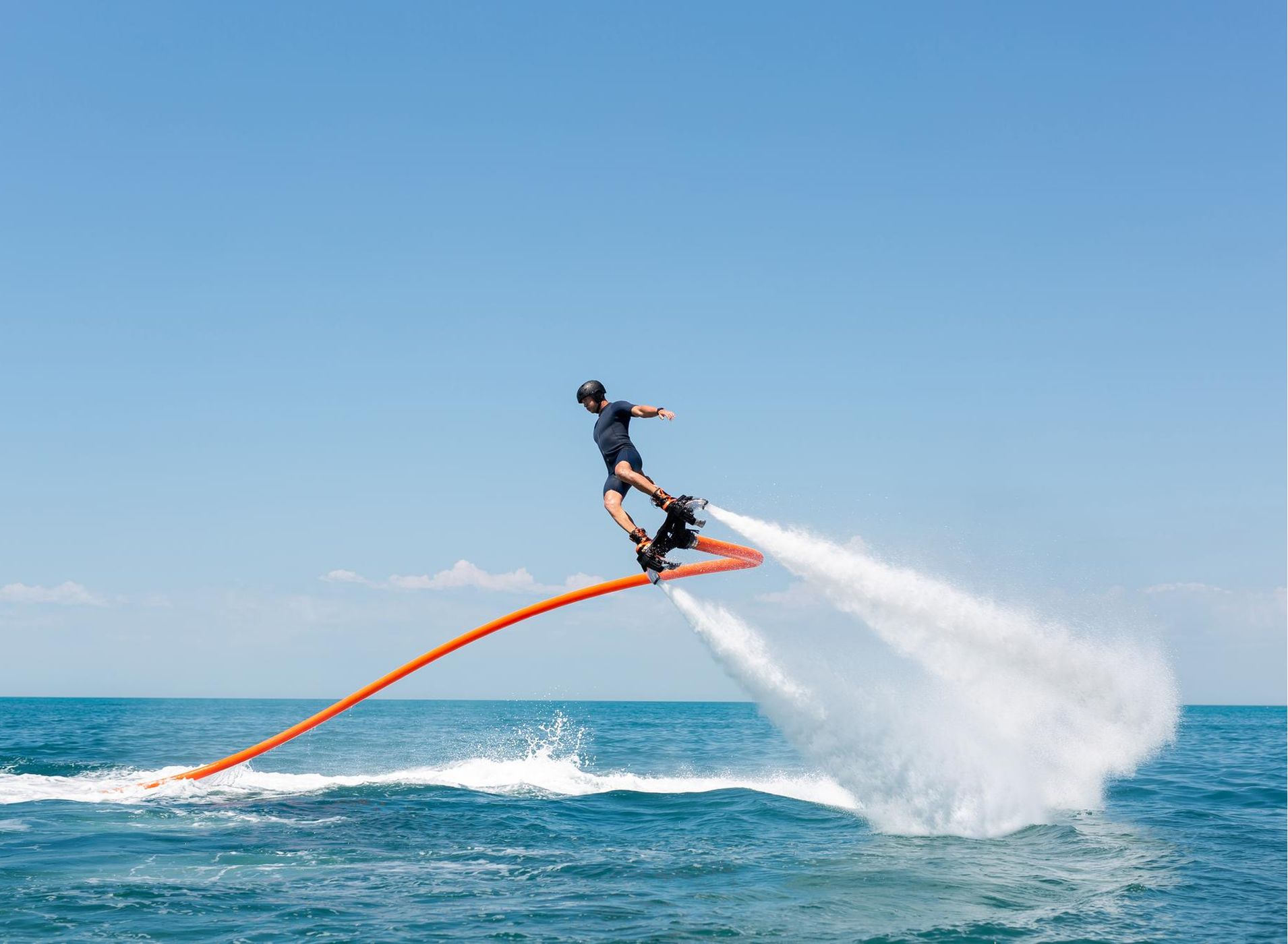 Flyboard rider lifted above the water