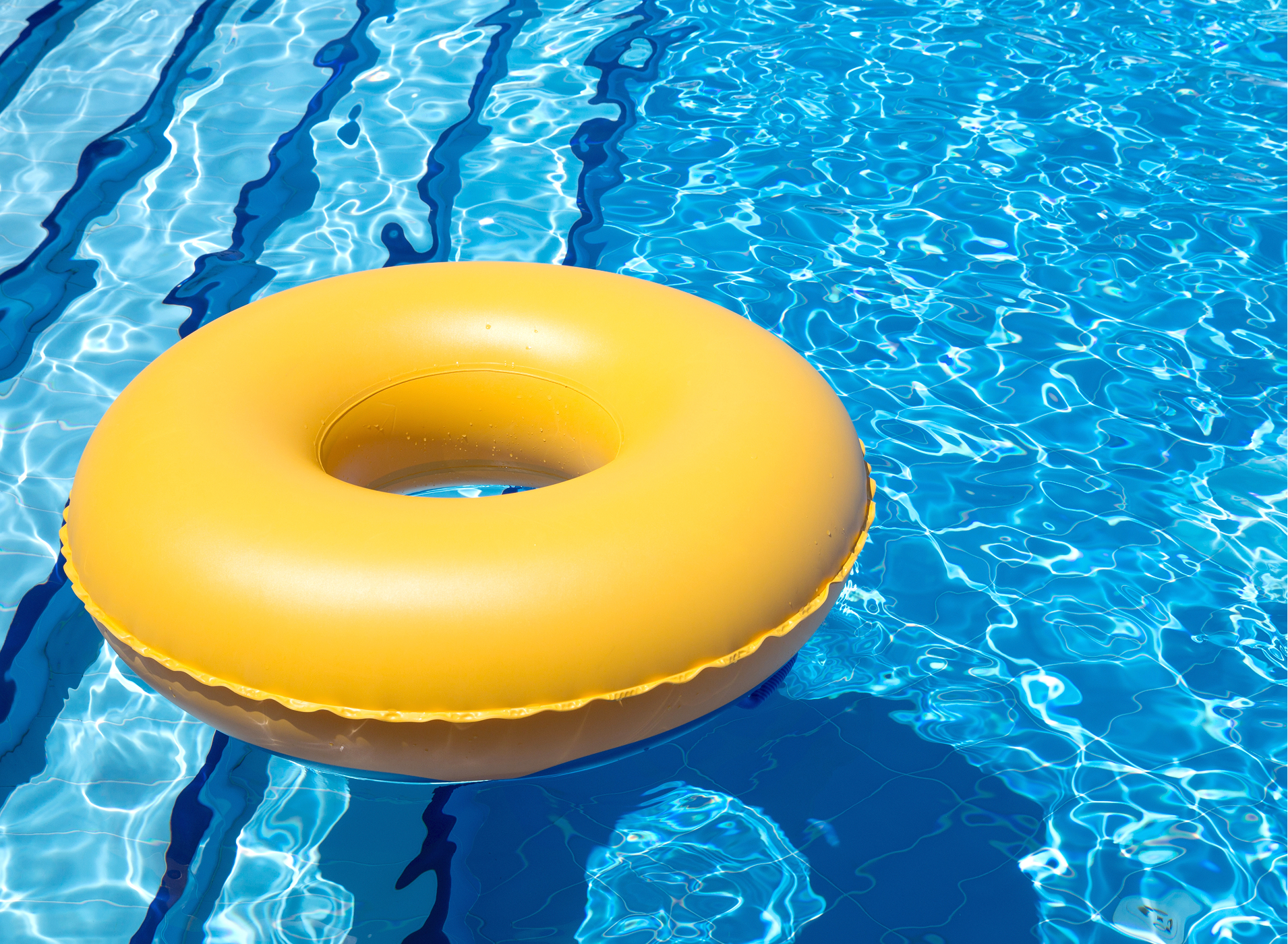 Small inflatable pool floats in the water